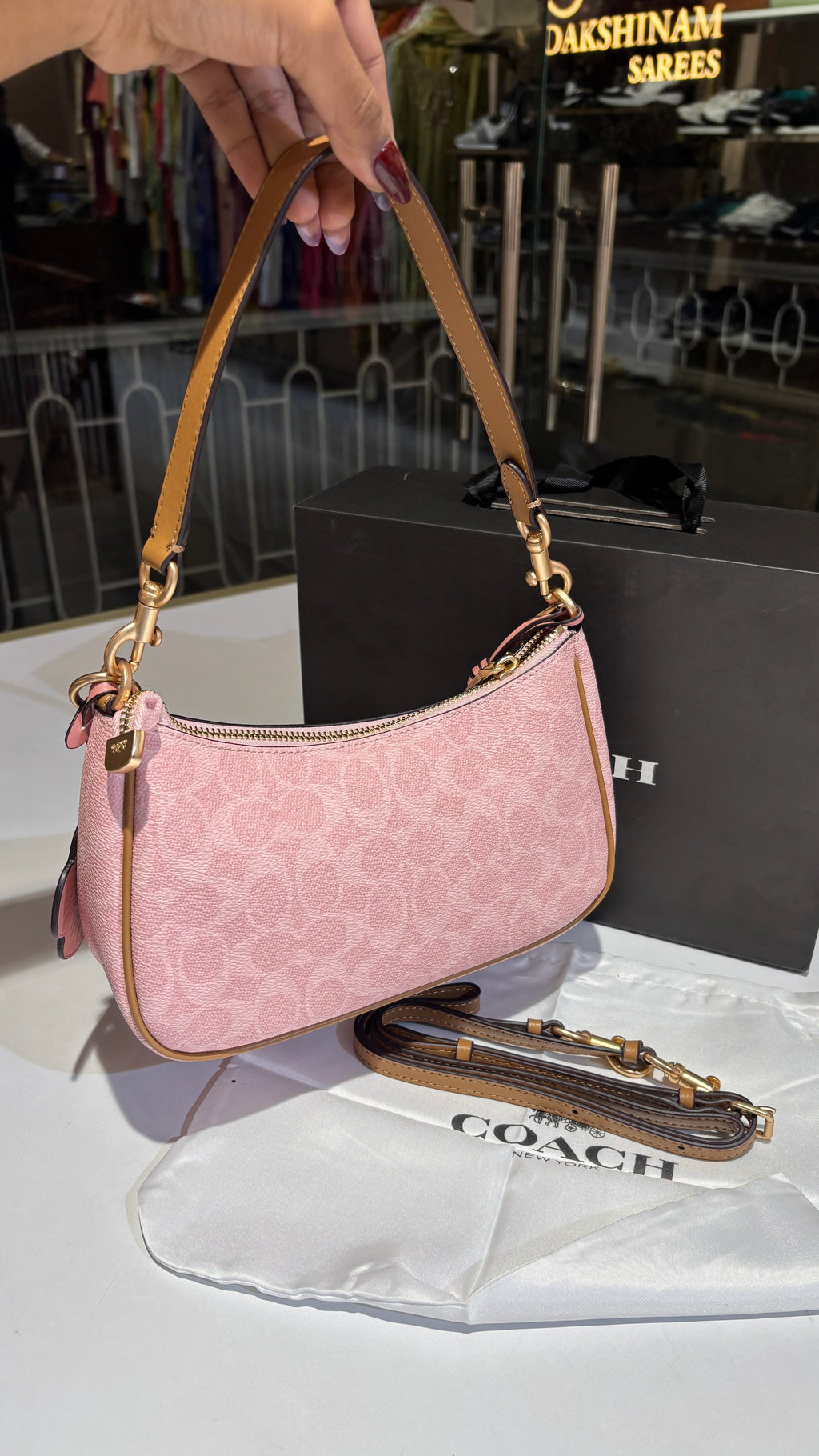 Signature monogram pink shoulder bag with charms