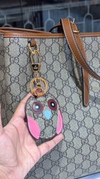 Signature monogram leather tote bag with charm