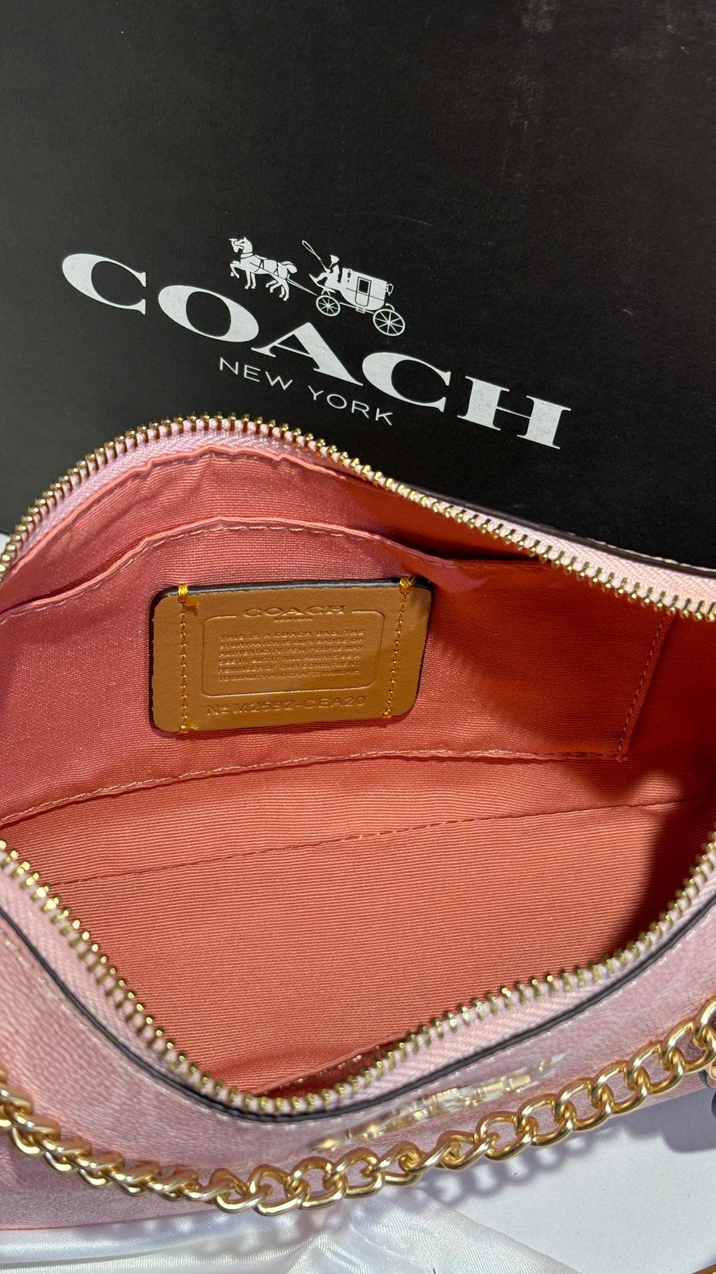 Signature monogram pink shoulder bag with charms