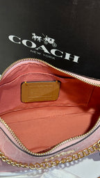 Signature monogram pink shoulder bag with charms