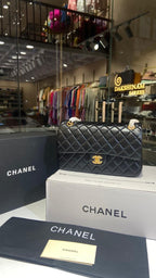 Quilted black sling bag