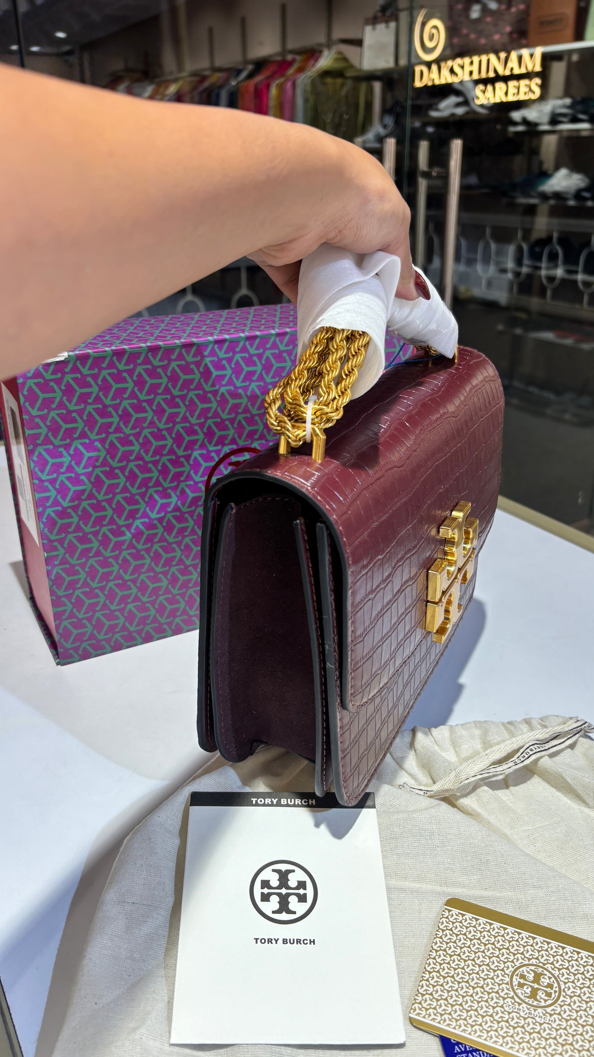 Quilted croc patterned sling bag