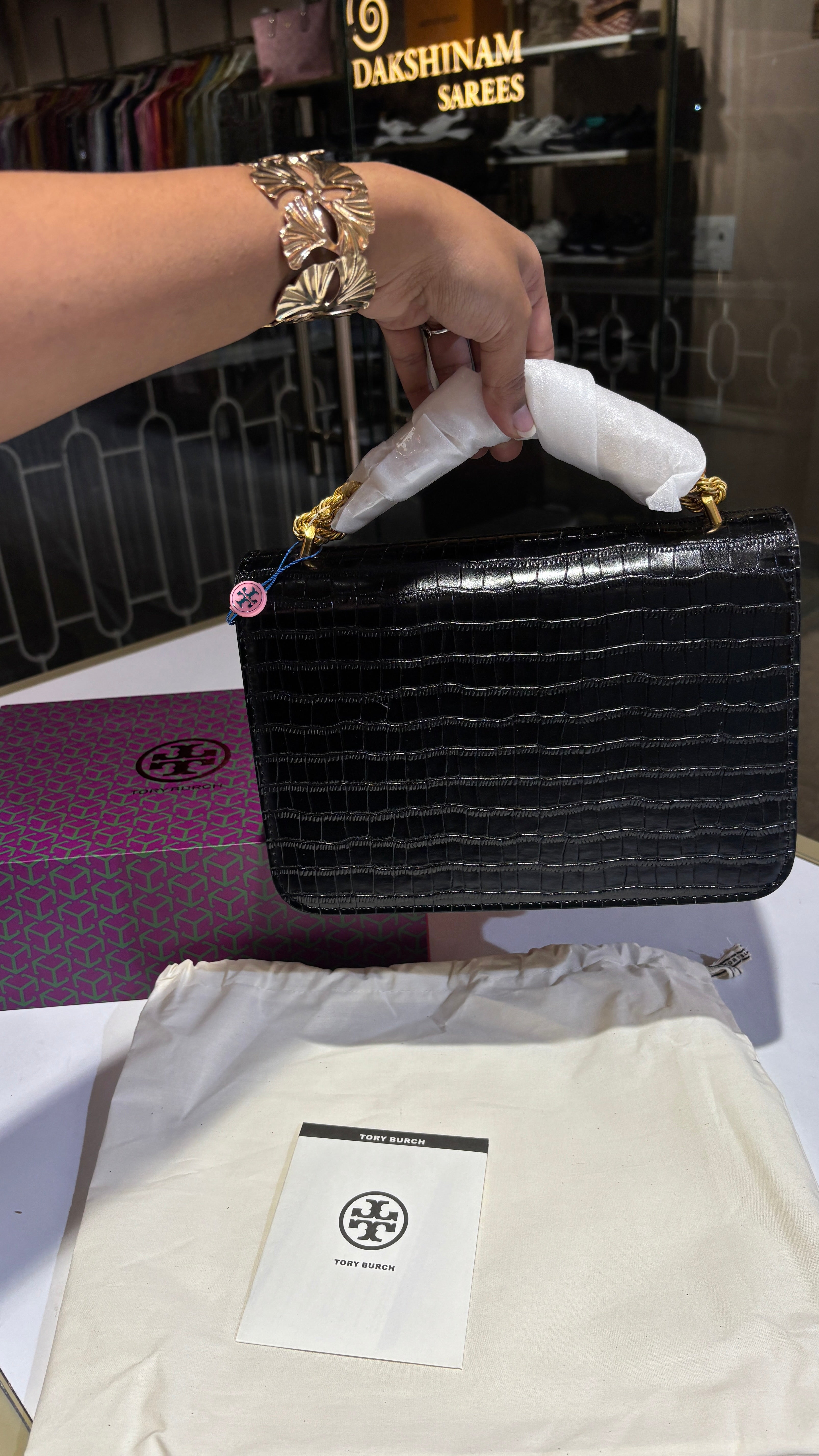 Quilted croc patterned sling bag