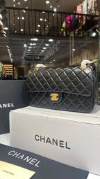 Quilted black sling bag