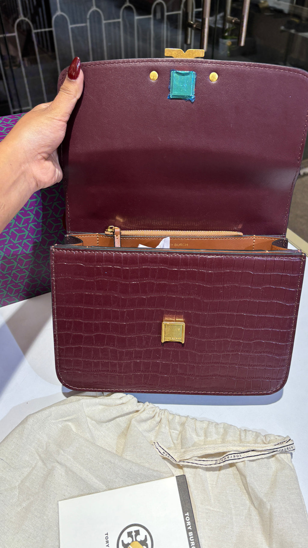 Quilted croc patterned sling bag