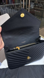 Gold Charm Accent Quilted Crossbody bag