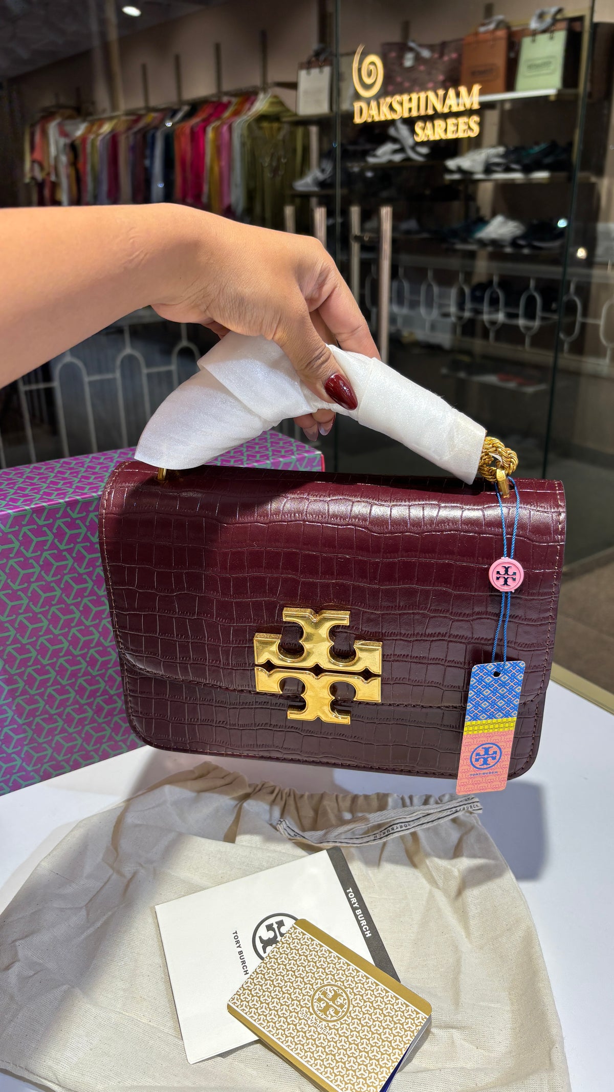 Quilted croc patterned sling bag