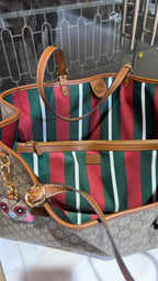 Signature monogram leather tote bag with charm