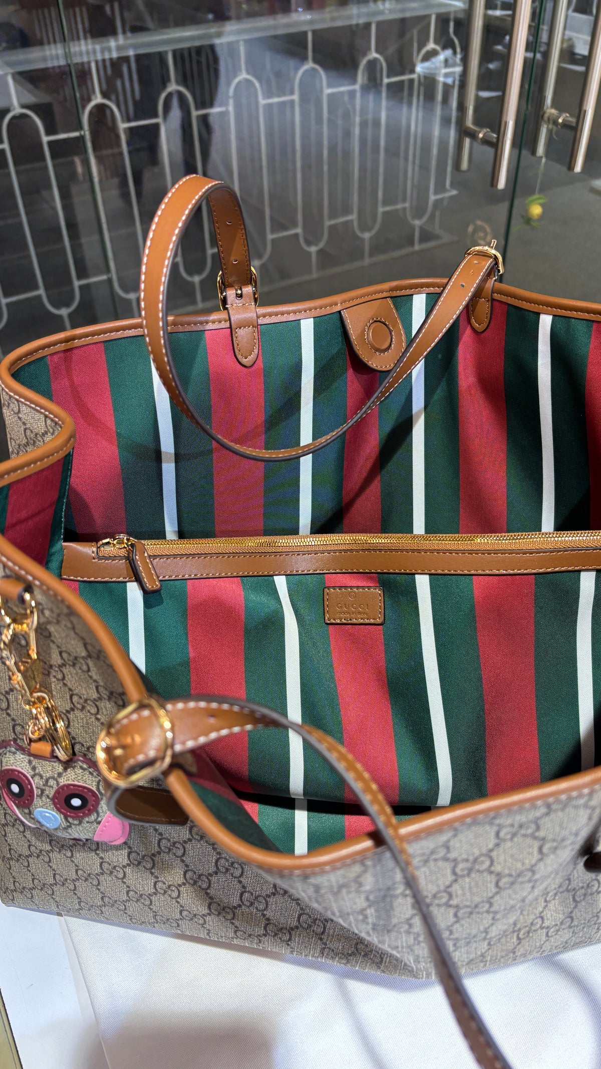 Signature monogram leather tote bag with charm