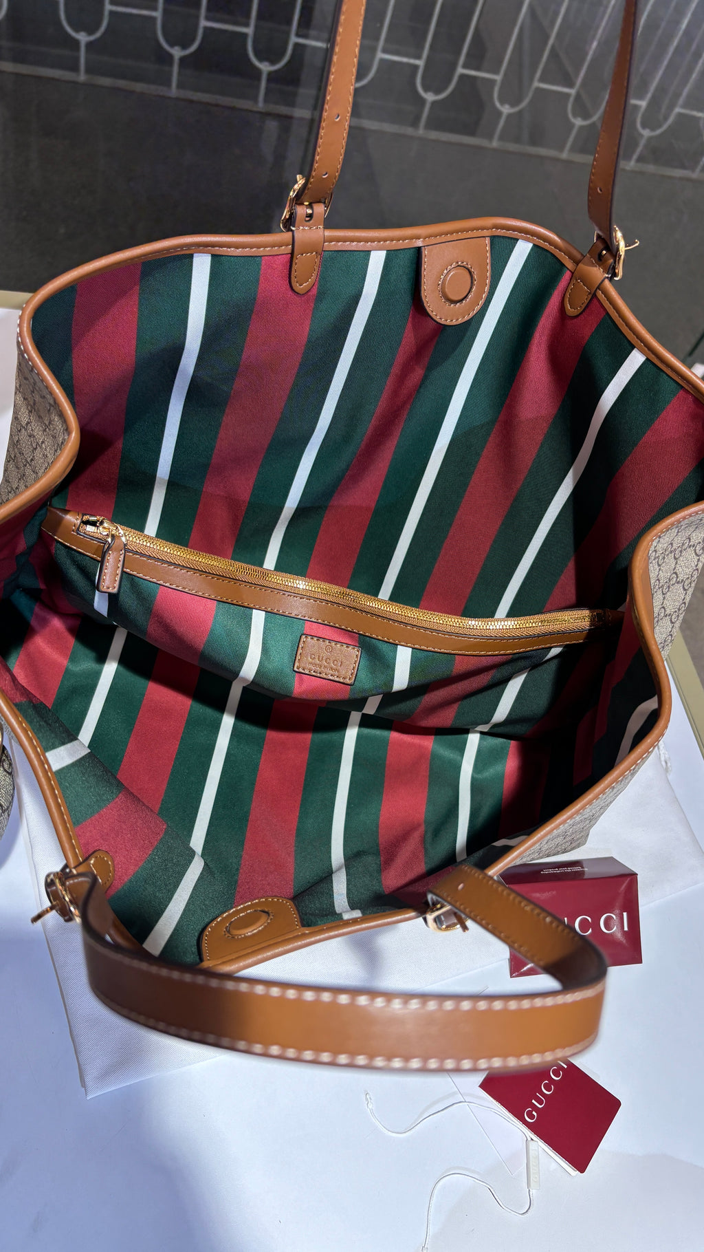 Signature monogram leather tote bag with charm