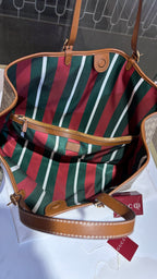 Signature monogram leather tote bag with charm