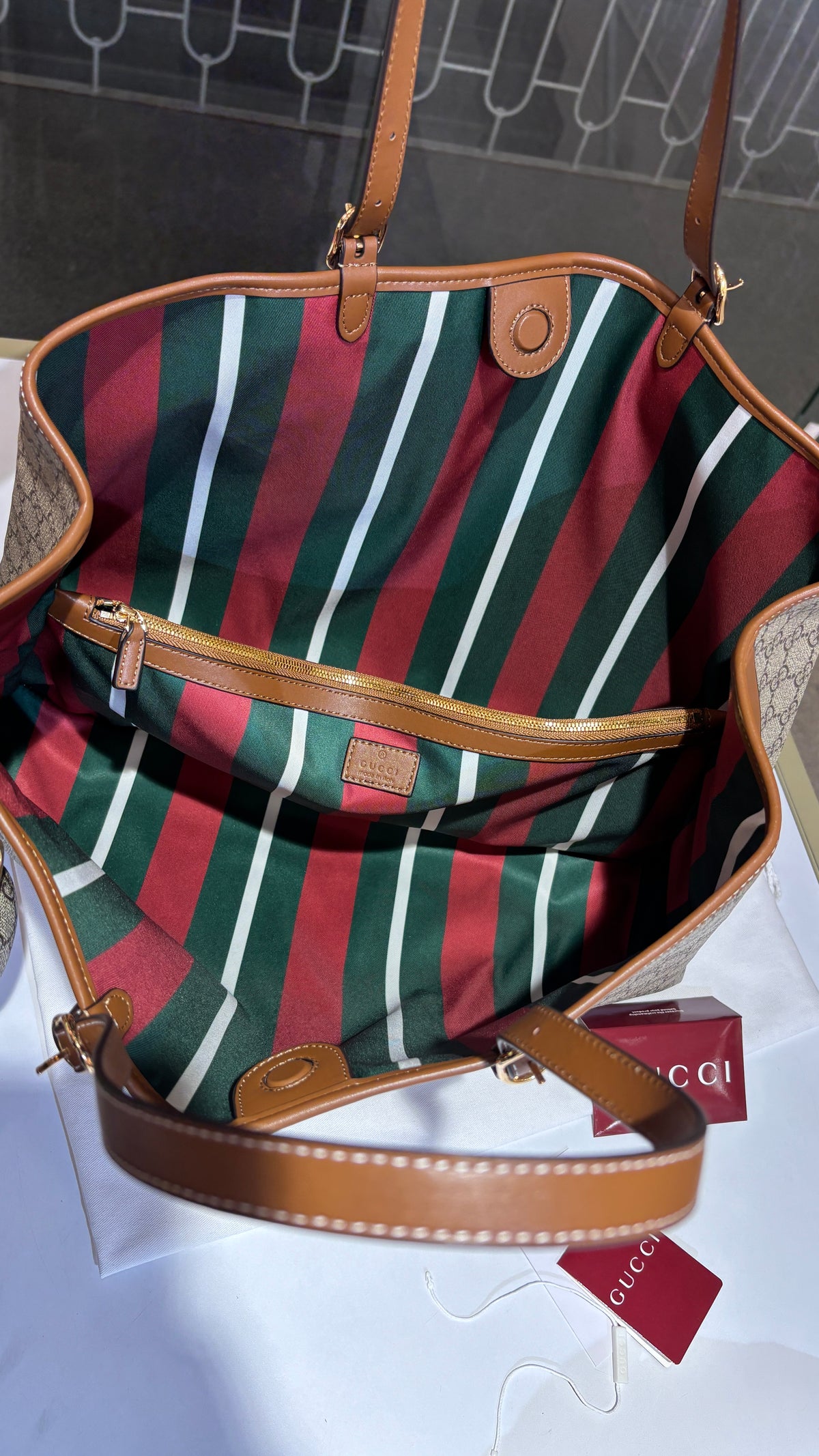 Signature monogram leather tote bag with charm
