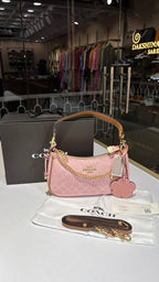Signature monogram pink shoulder bag with charms