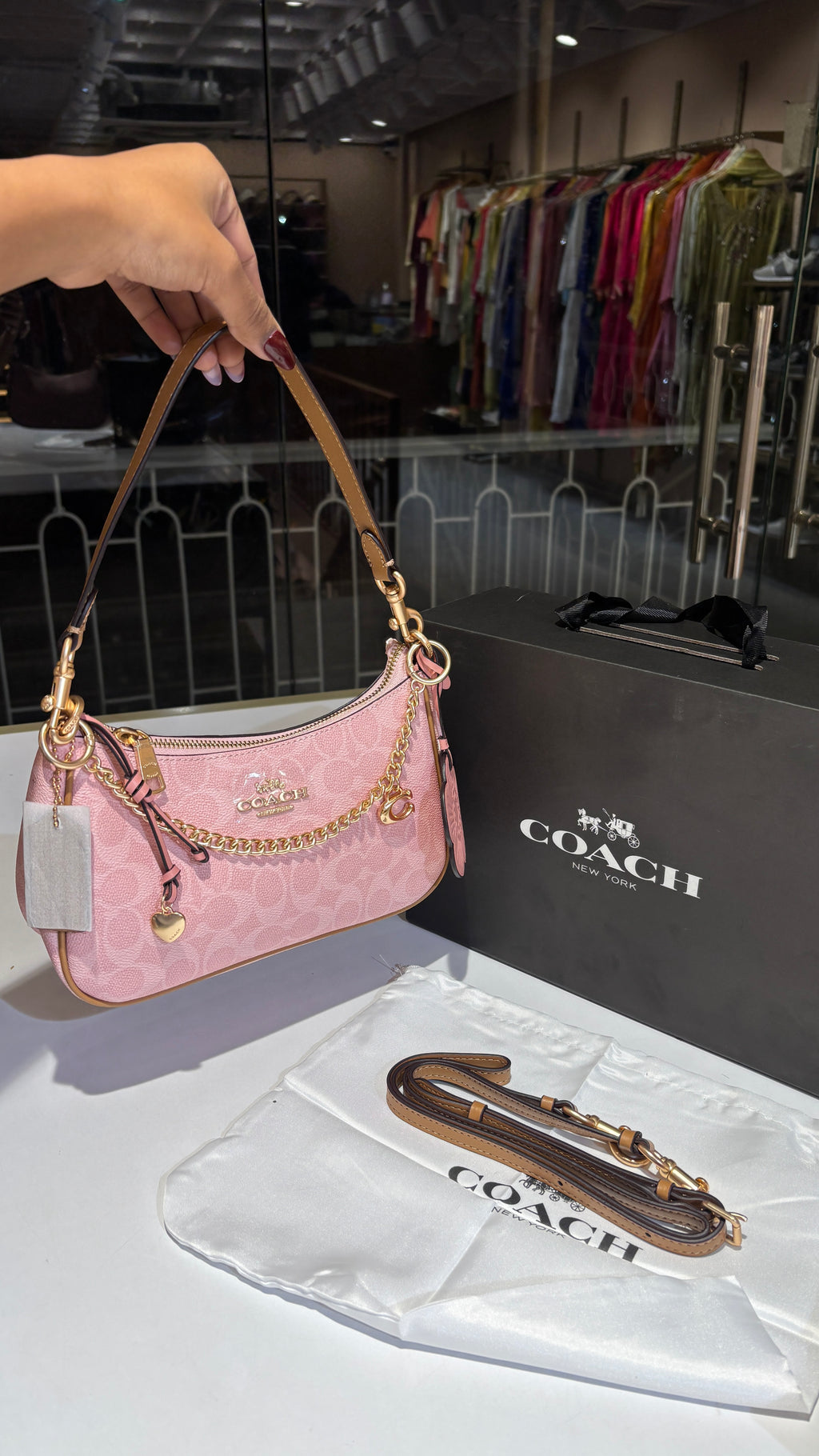 Signature monogram pink shoulder bag with charms