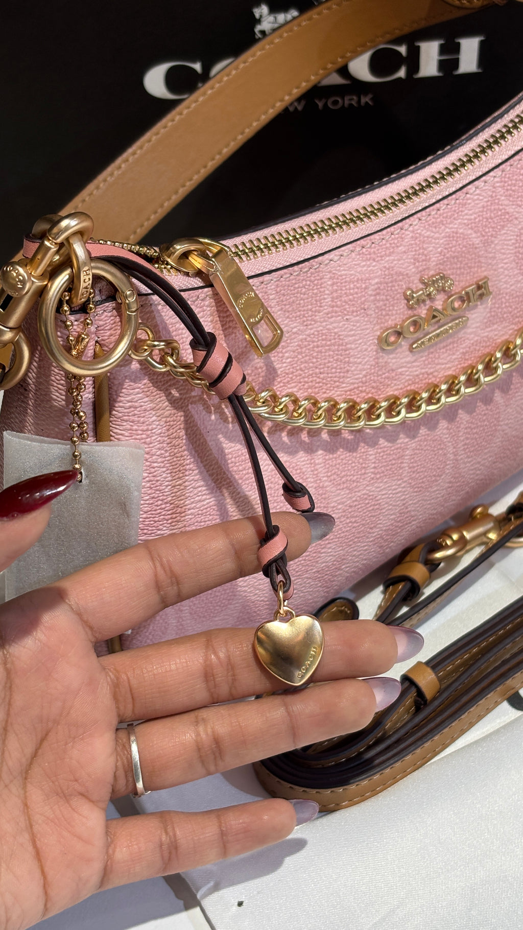 Signature monogram pink shoulder bag with charms