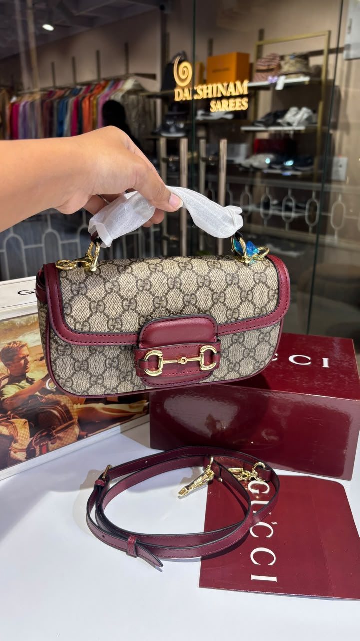Structured monogram sling bag with detachable sling