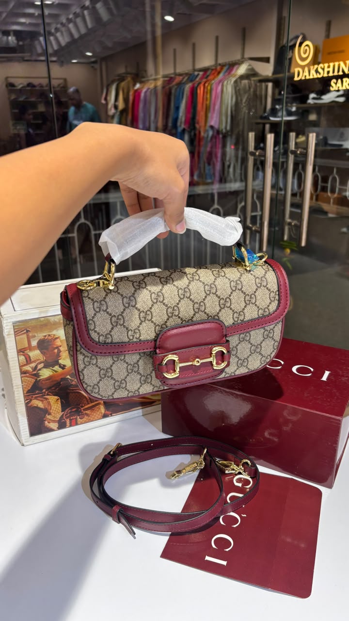 Structured monogram sling bag with detachable sling