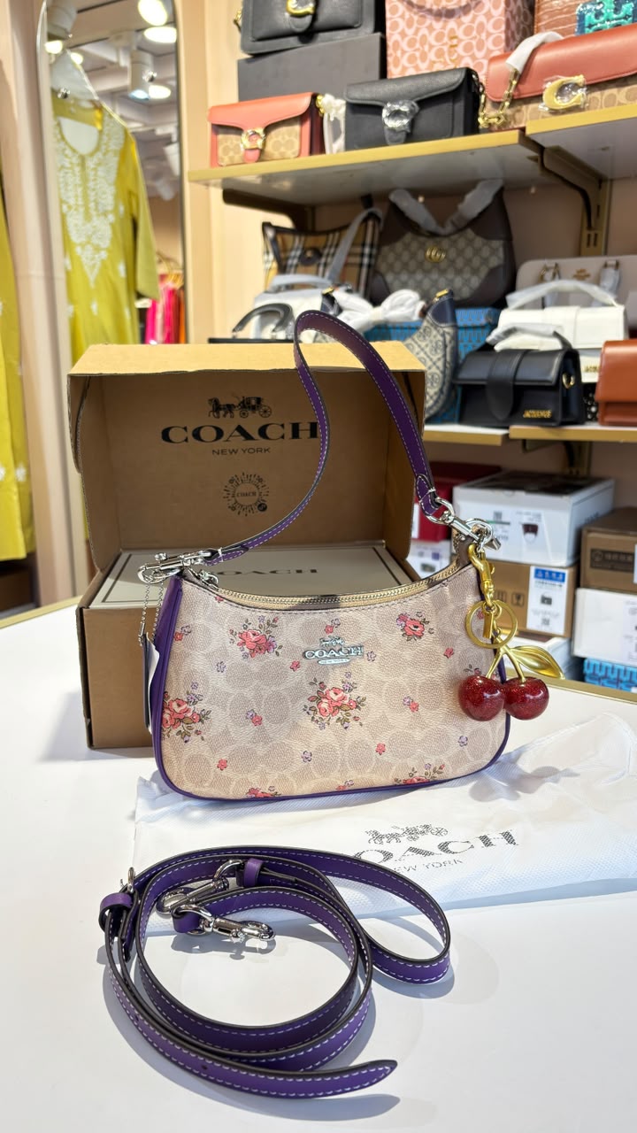 Floral print shoulder bag with cherry charm