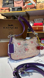 Floral print shoulder bag with cherry charm