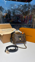 Signature monogram vanity bag with detachable slings