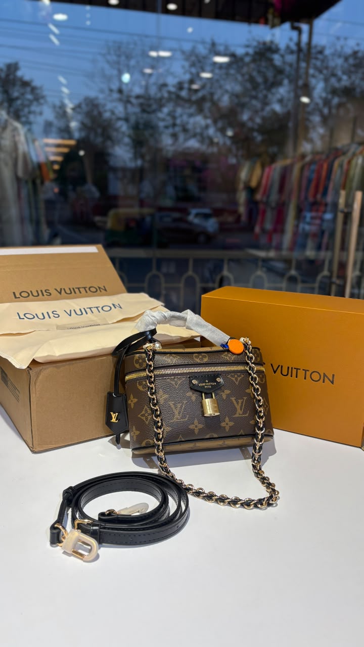 Signature monogram vanity bag with detachable slings