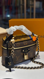 Signature monogram vanity bag with detachable slings