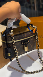 Signature monogram vanity bag with detachable slings