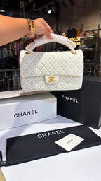 Quilted white sling bag