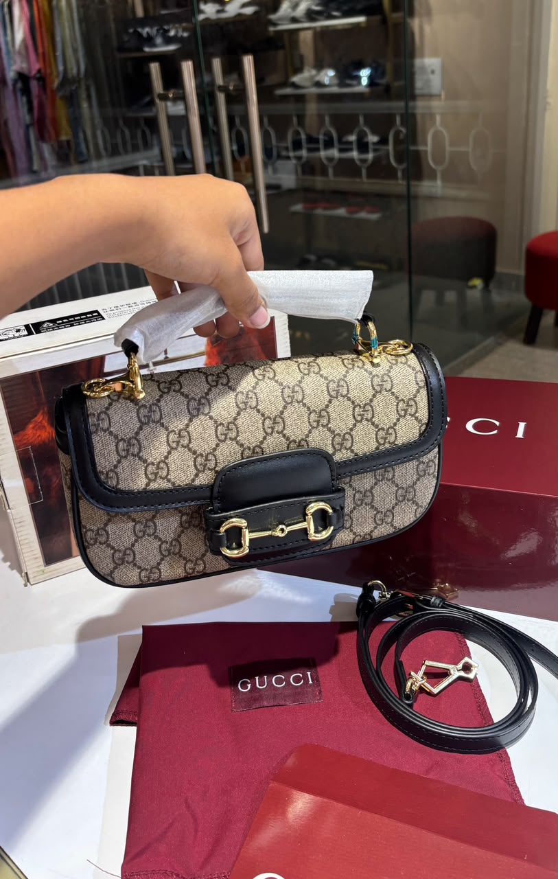 Structured monogram sling bag with detachable sling