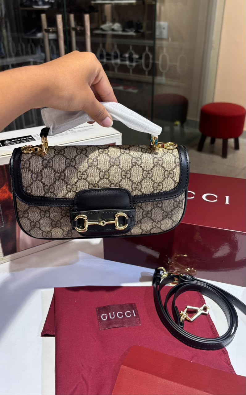 Structured monogram sling bag with detachable sling