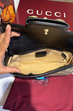 Structured monogram sling bag with detachable sling