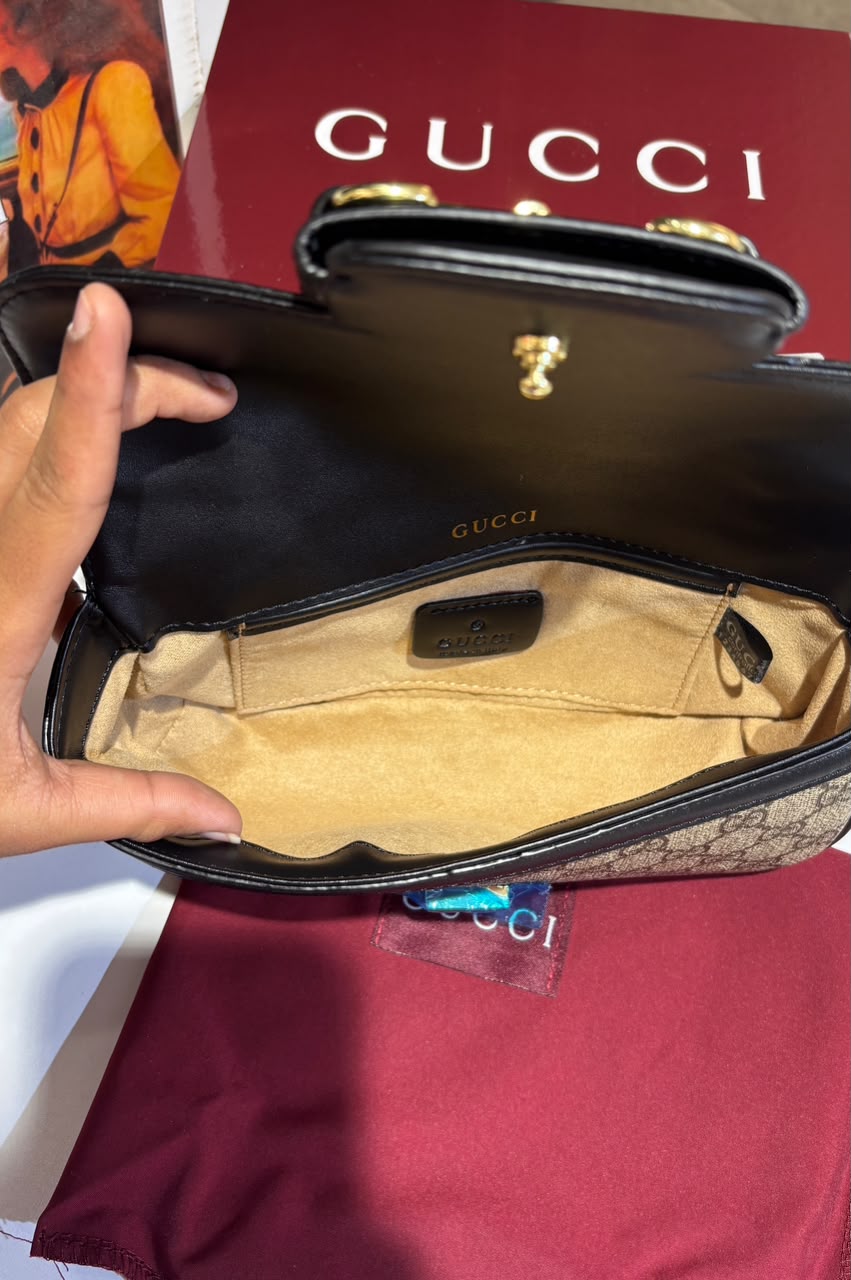 Structured monogram sling bag with detachable sling