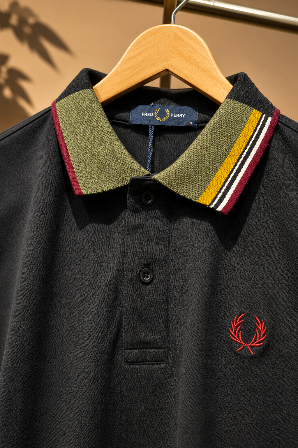 Black Polo T-Shirt with Multicolor Striped Collar.
