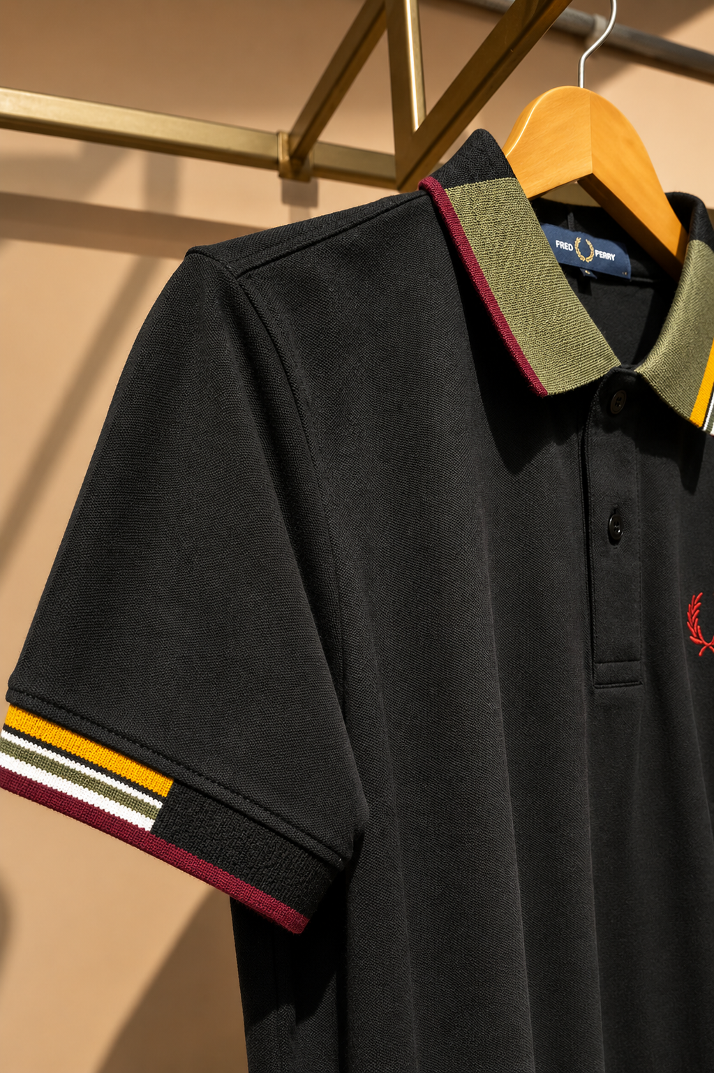 Black Polo T-Shirt with Multicolor Striped Collar.